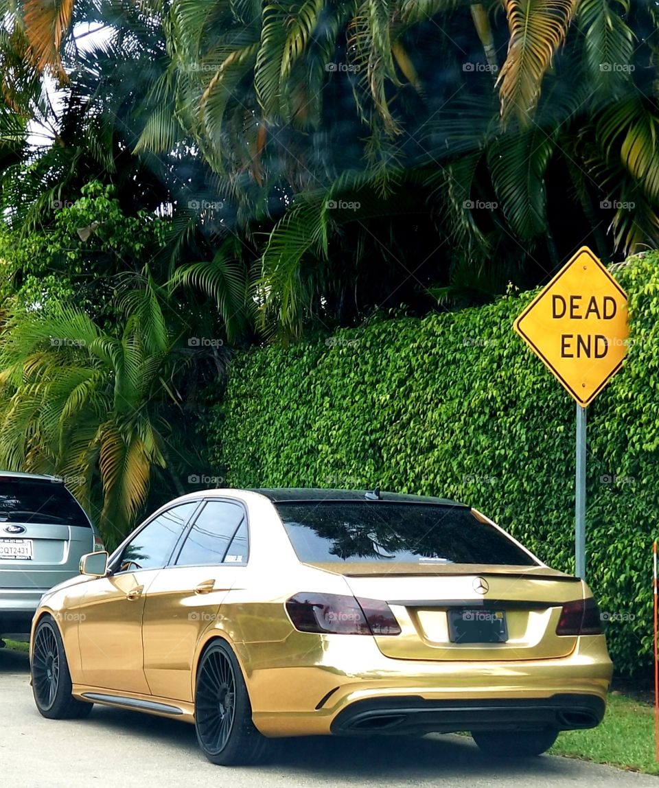 Bright gold Mercedes Benz, Fort Lauderdale.  Where else?