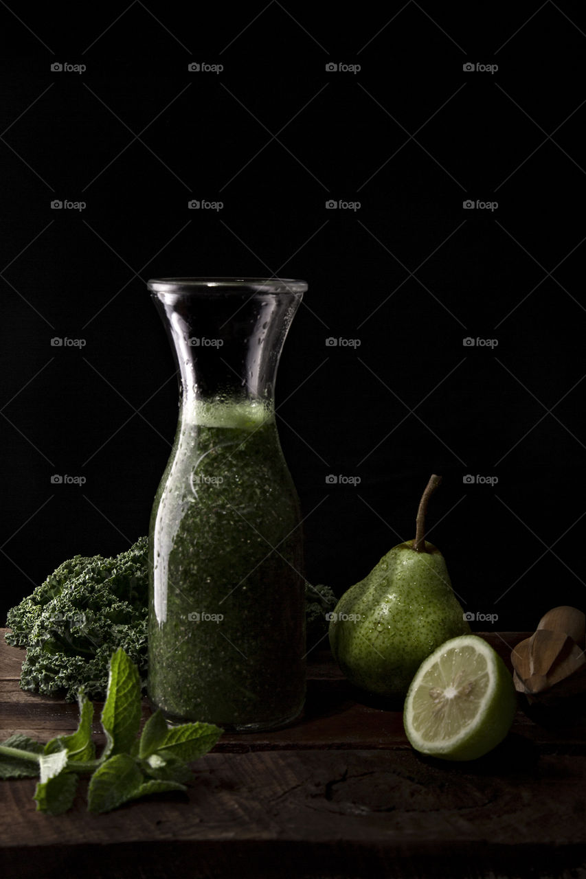 Green smoothie with dressings.  Dark composition