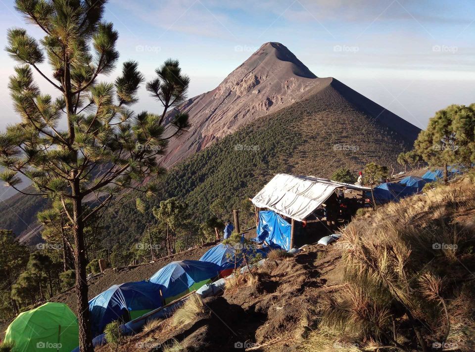 camping on a volcano viewing an onter volcano