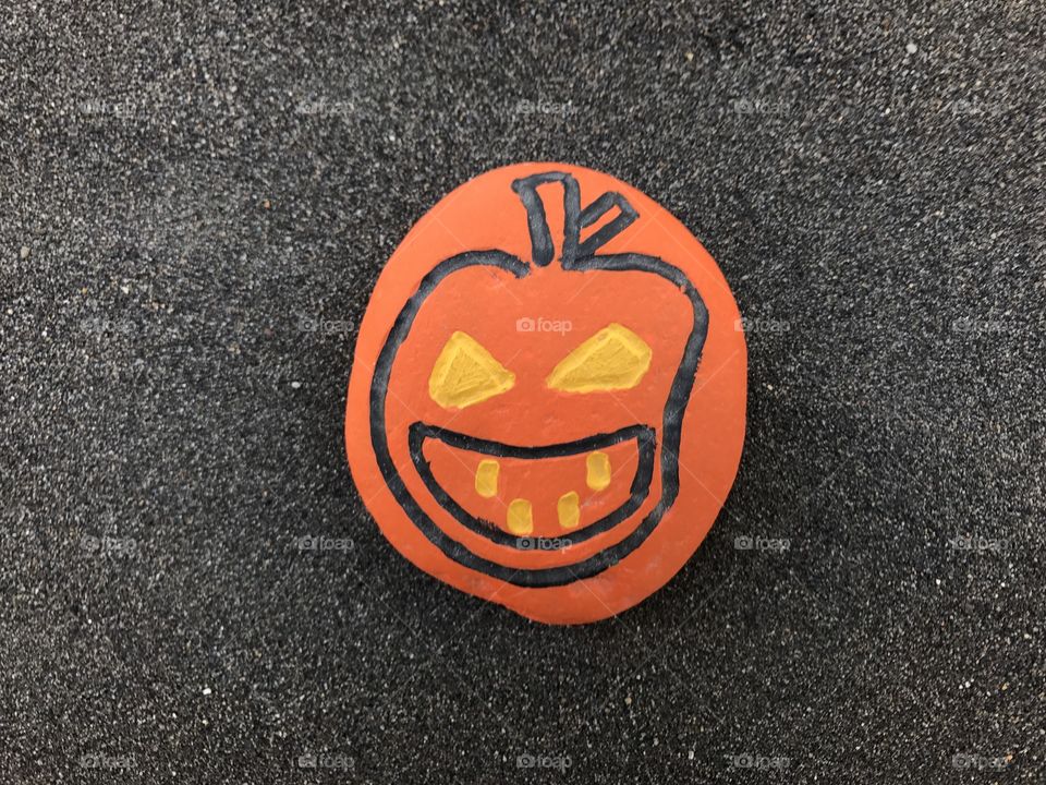 Pumpkin design on a stone