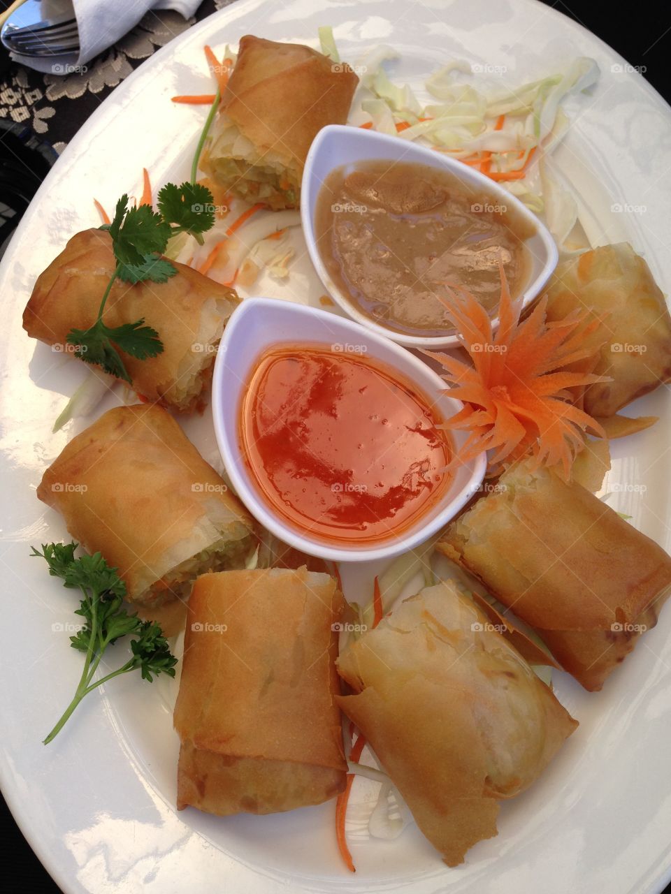 Spring rolls with sweet and sour and peanut dip sauce