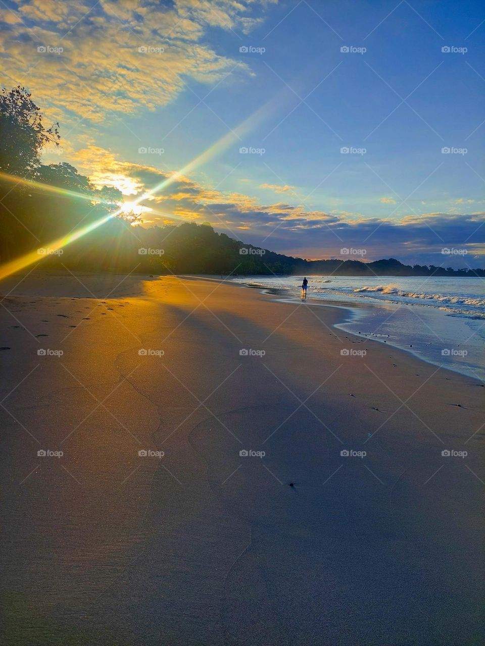 Sunrise on the beautiful sandy beach of Manuel Antonio on Pacificocean.  Costa Rica