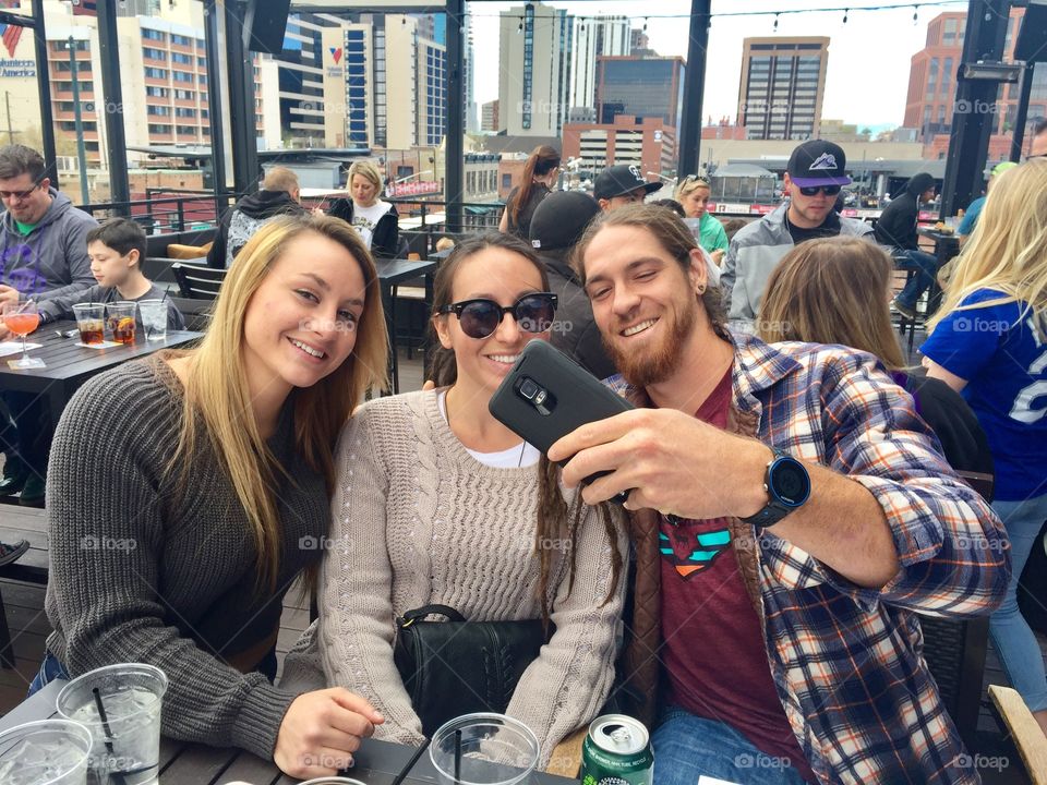 Candid selfie on roof top bar