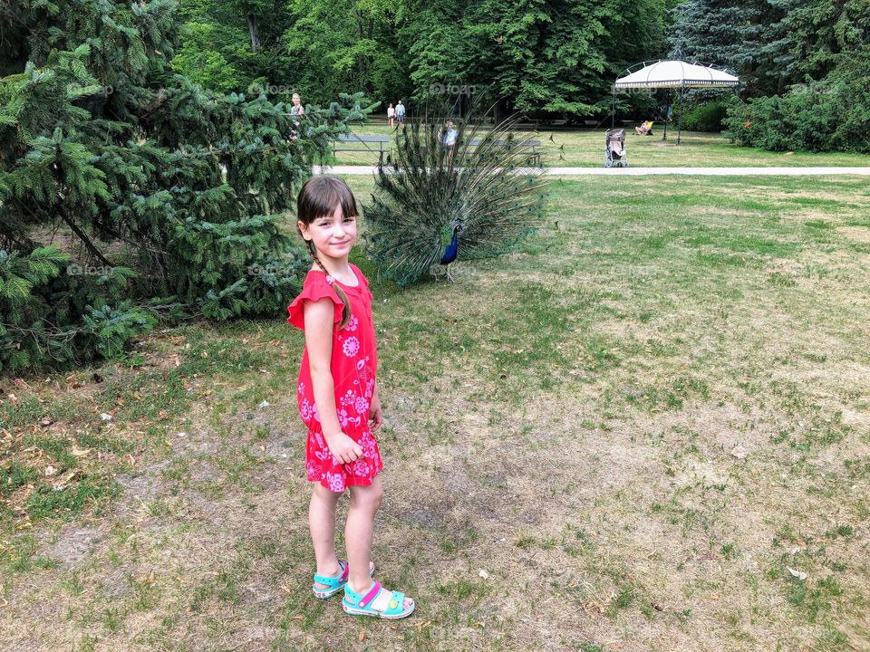 Girl and peacock 