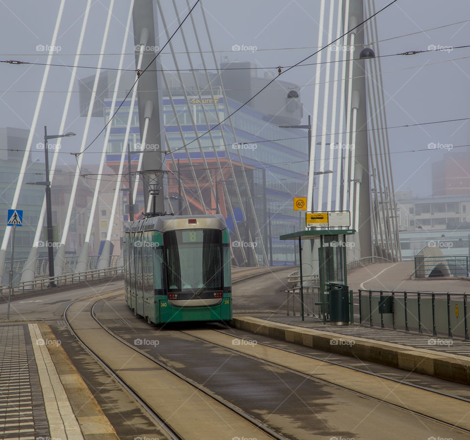 tram rides on the bridge