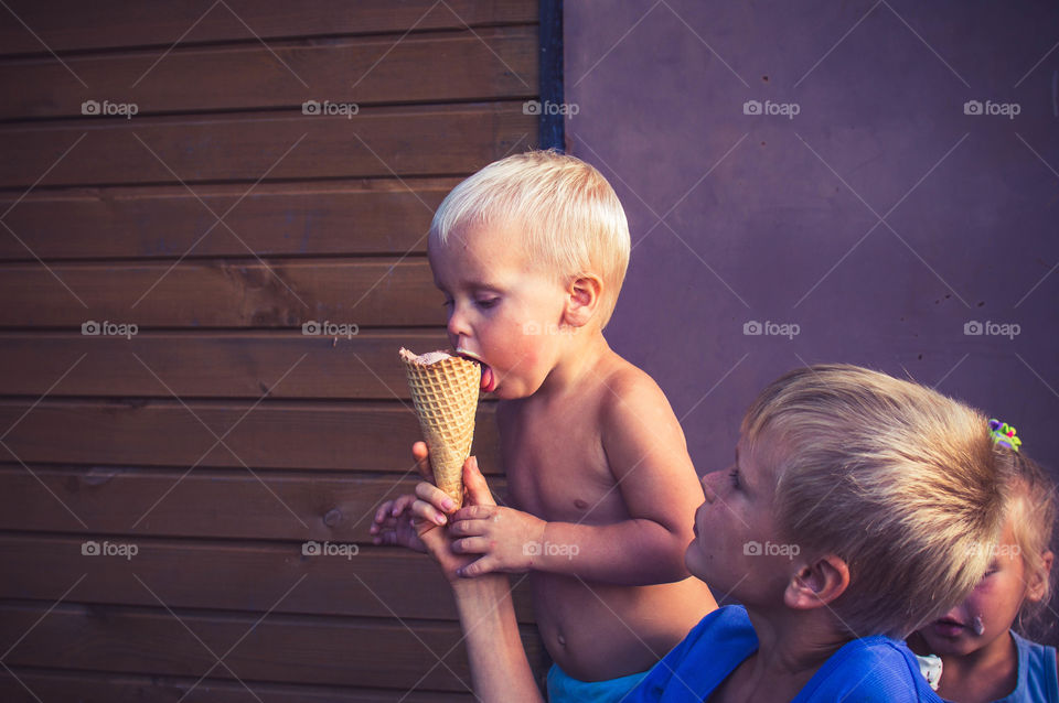 Little boy is eating ice cream