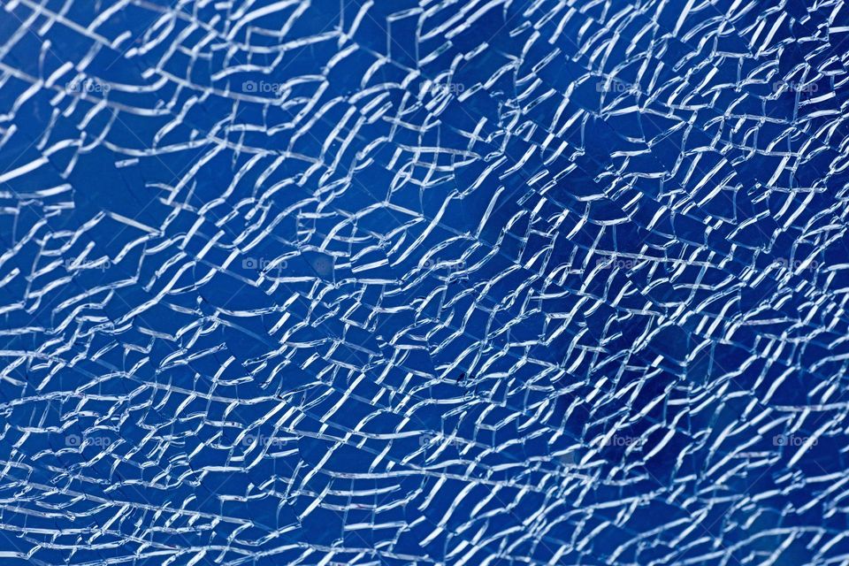 Blue cracked window glass damage situation be careful abstract background