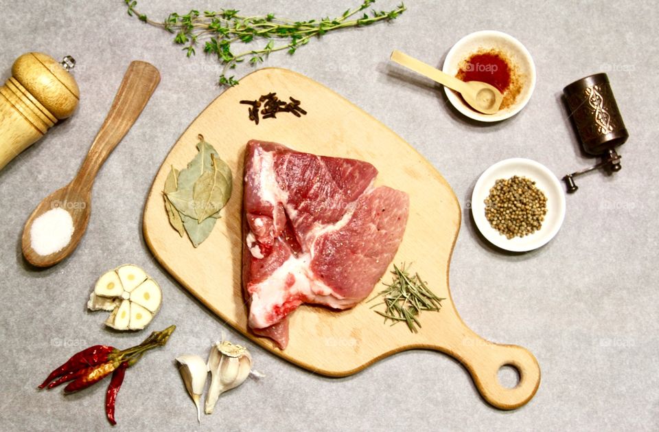 High angle view of raw meat on cutting board