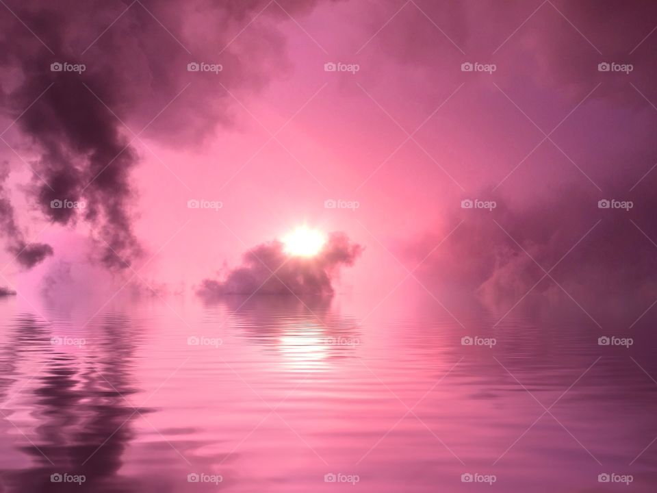 Blushing pink sunset reflected. Blushing pink sunset over water
