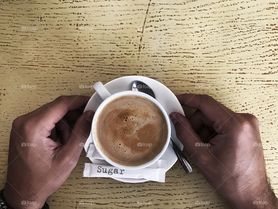 Cappuccino with milk on wooden table 