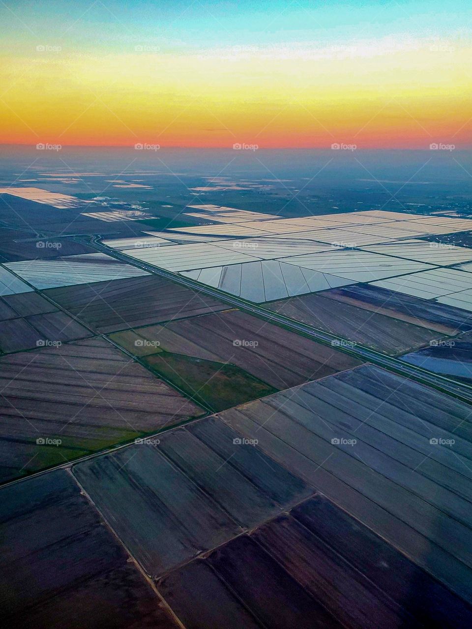 Various fields of crops create a checkerboard pattern in California's central valley