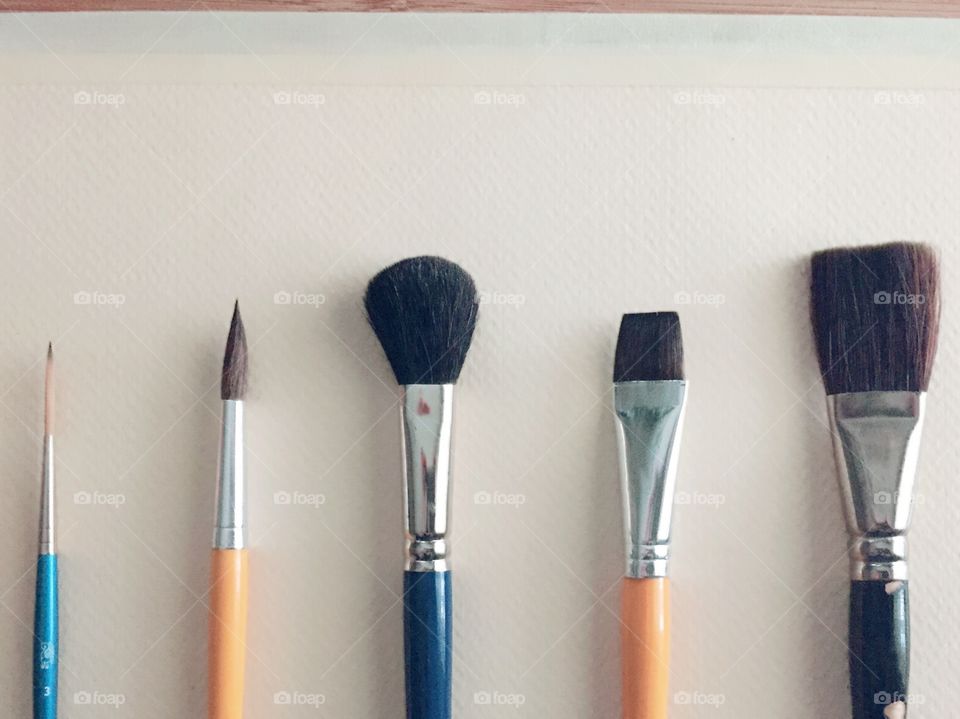 Variety of brushes on background