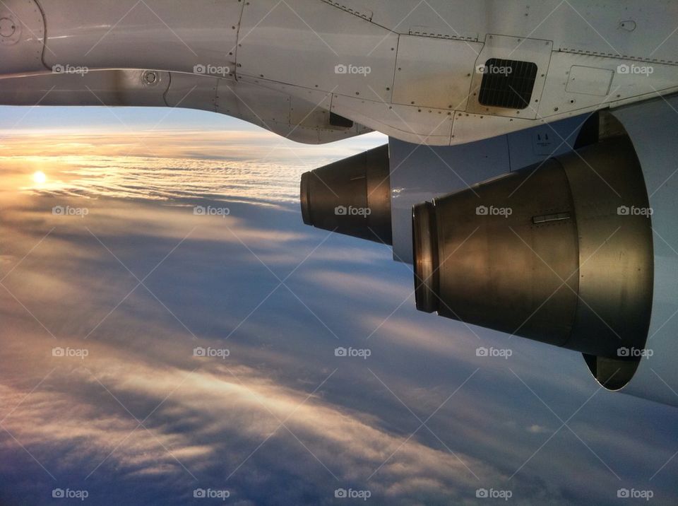 sky clouds sun airplane by yoakeem
