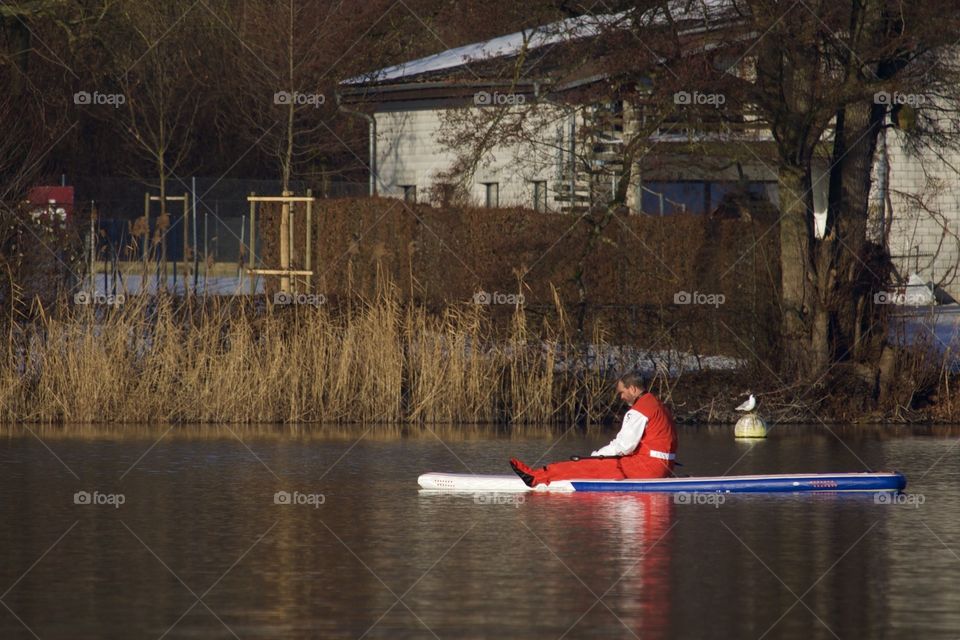 Stand Up Paddler Meditating