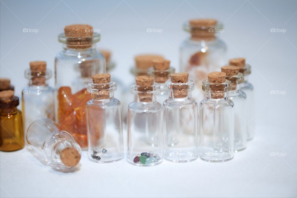 Small bottles over white background