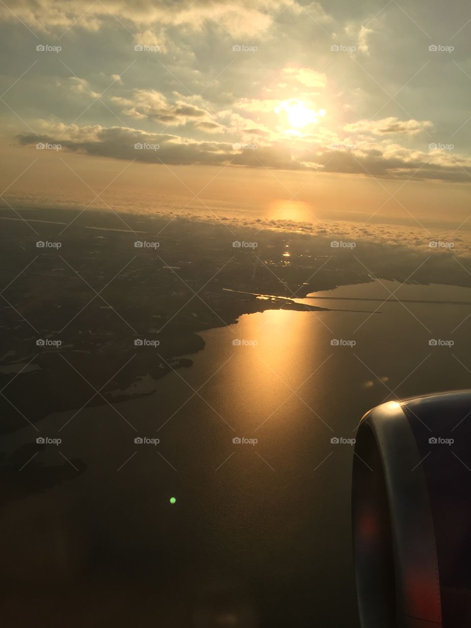 Sunset over Saint Pete Beach as seen upon approach to Tampa Airport.