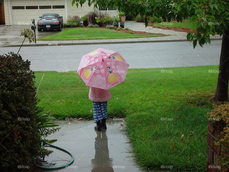 A little girl in the rain