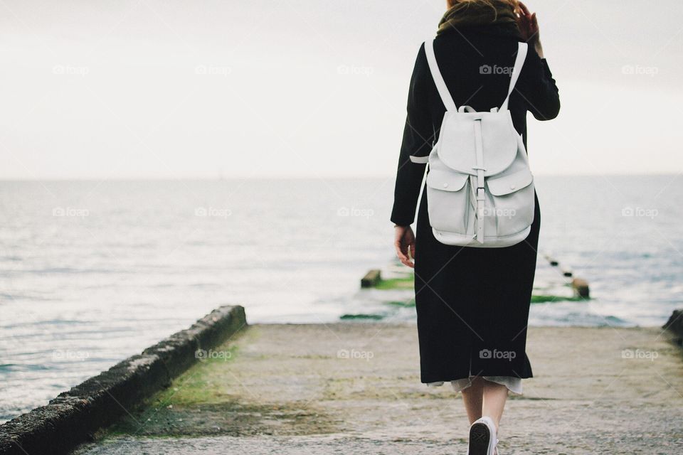 Women walking on pier