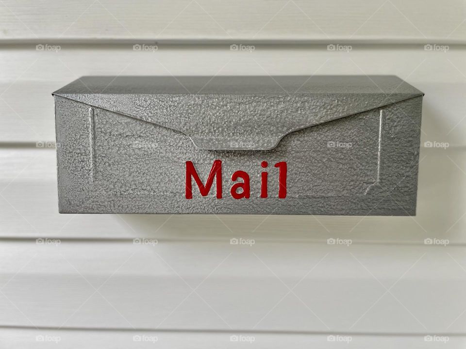 Mailbox on residential home, painting letters on a mailbox, red lettered mail box, ready for the post man, daily routines at your home, checking for the mail