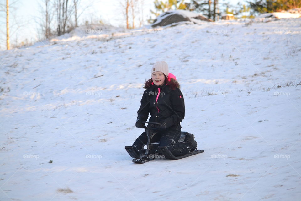 Girl sledding