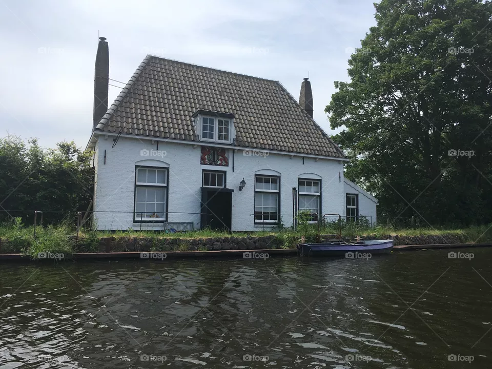 Detached house along the water rotterdam