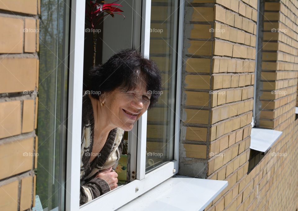 woman smiling in window view