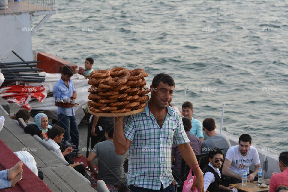 Simits vendor front of the Maiden's Tower, Kiz Kulesi, Istanbul, Turkey