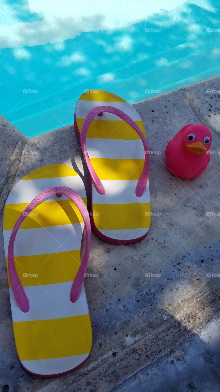 Pink duck and flip flops