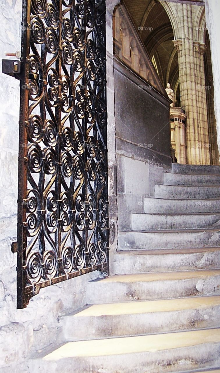 Steps spiraling up from the crypt into the interior of the Abbey of Saint Denis in Paris, France