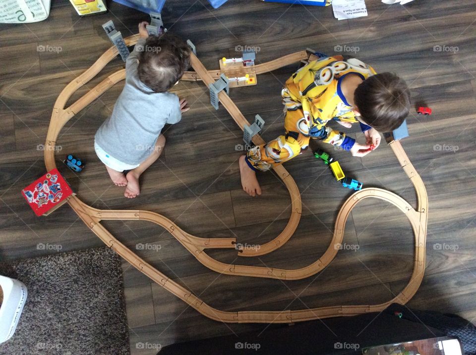 Children playing with a train set