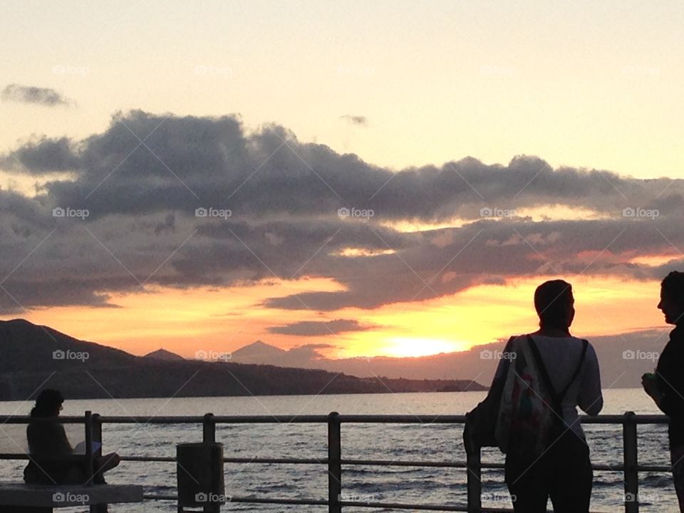 Watching the relaxing sunset at the beach avenue 