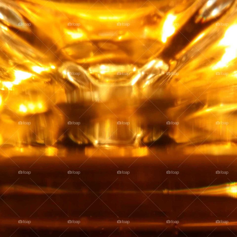 Golden Macro Shot of Juice in a Glass