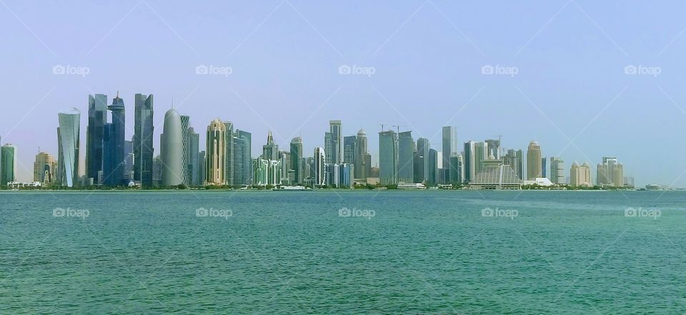 View from the Persian Gulf to the coast with skyscrapers in Doha, Qatar