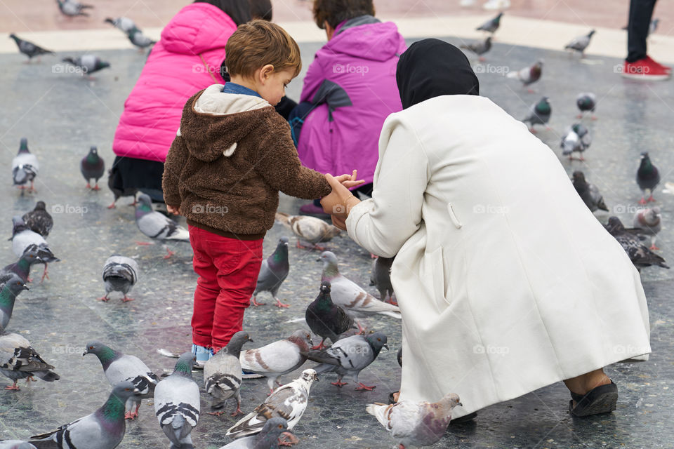 Mother, son and Pigeons 