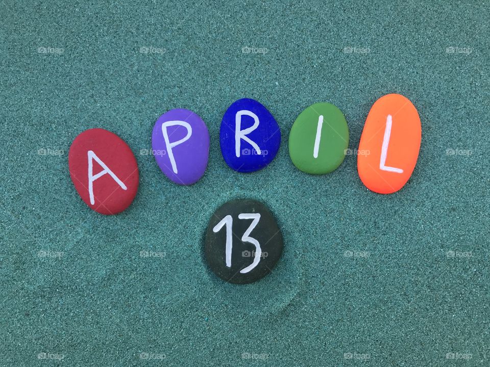 13 April, calendar date with colored stones 