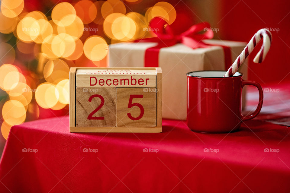 Christmas background with wooden block calendar with the date of December 25