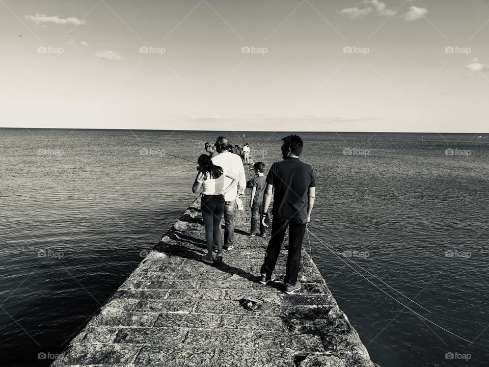 Well we have all heard of the dreaded”no waiting yellow lines.” With this photo you have double white lines. It is actually the fishermen’s fishing rods in Dawlish, Devon, UK. Makes the photo bit unique.