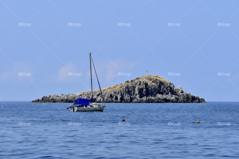 Boat sitting near the island in summer 