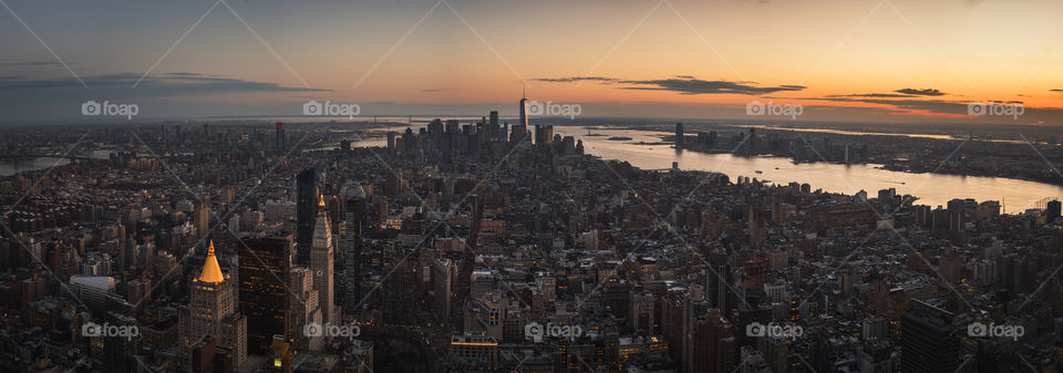 Giant panorama of downtown Manhattan from the Empire State Building at sunset in New York 