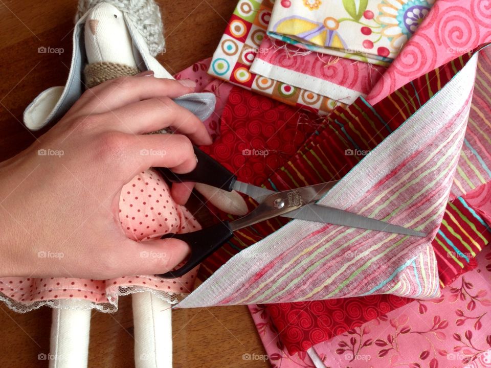 Women hand working with tissue and scissors  