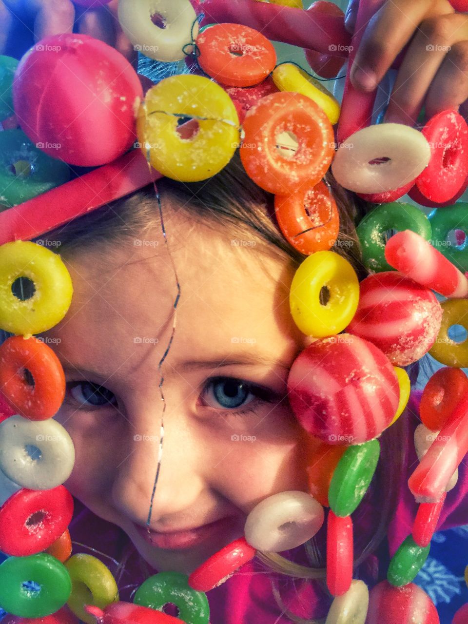 Girl surrounded with candies