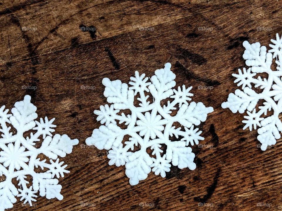 snowflakes on wooden background