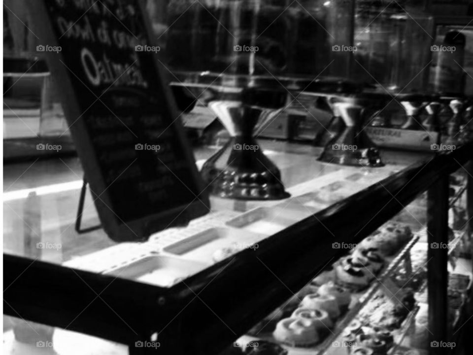 A New York Bakery in black and white. Cakes, cupcakes, chalk board. 
