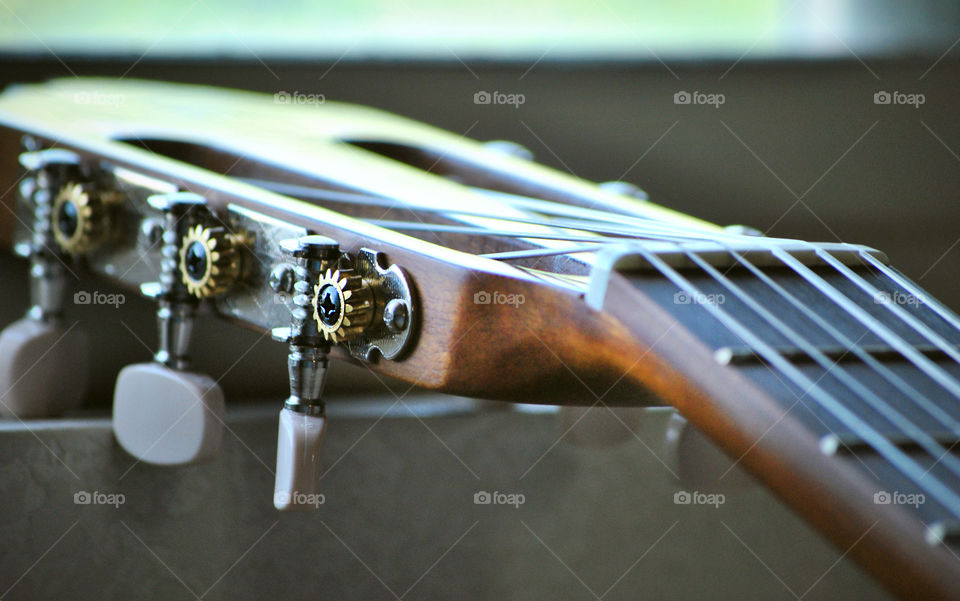 macro shot, acoustic guitar head, tuner, closeup