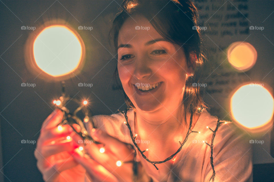 Happy girl playing with lights