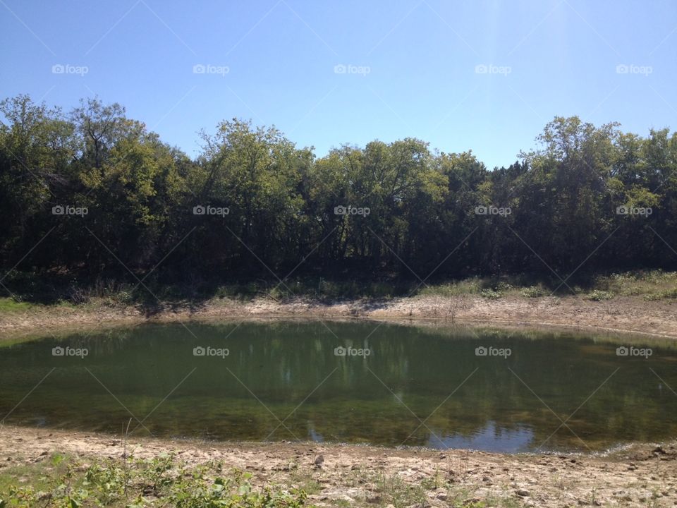 Very low tank or pond in Texas.. Very low pond in Texas during Summer.