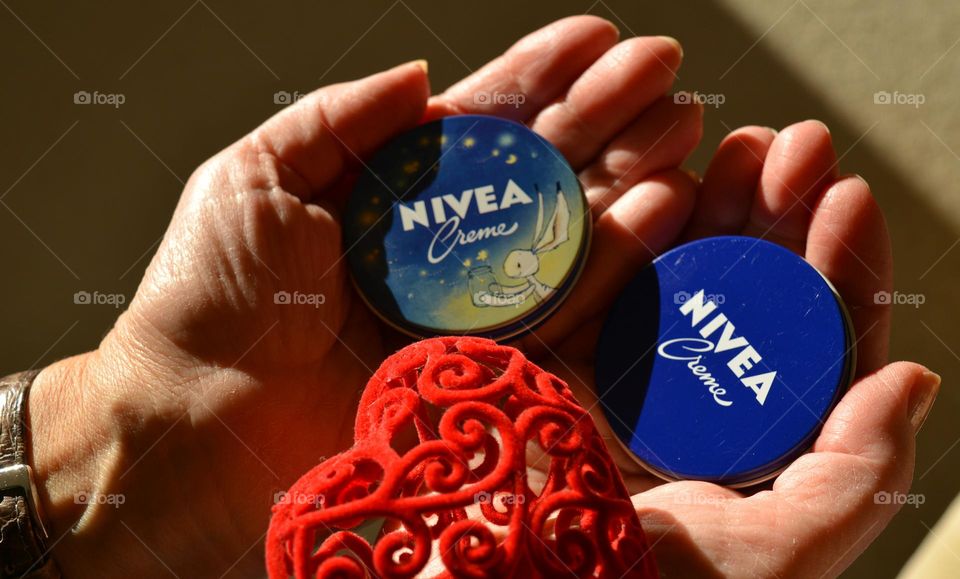 love Nivea, cream in the female hands