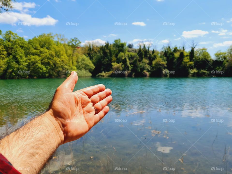 male hand shows the wonders of nature