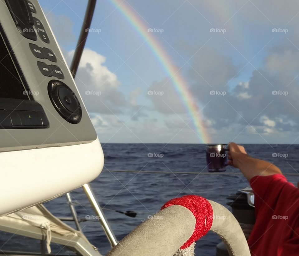 Catch Some Sunshine. Trying to catch this rainbow for a little warming drink