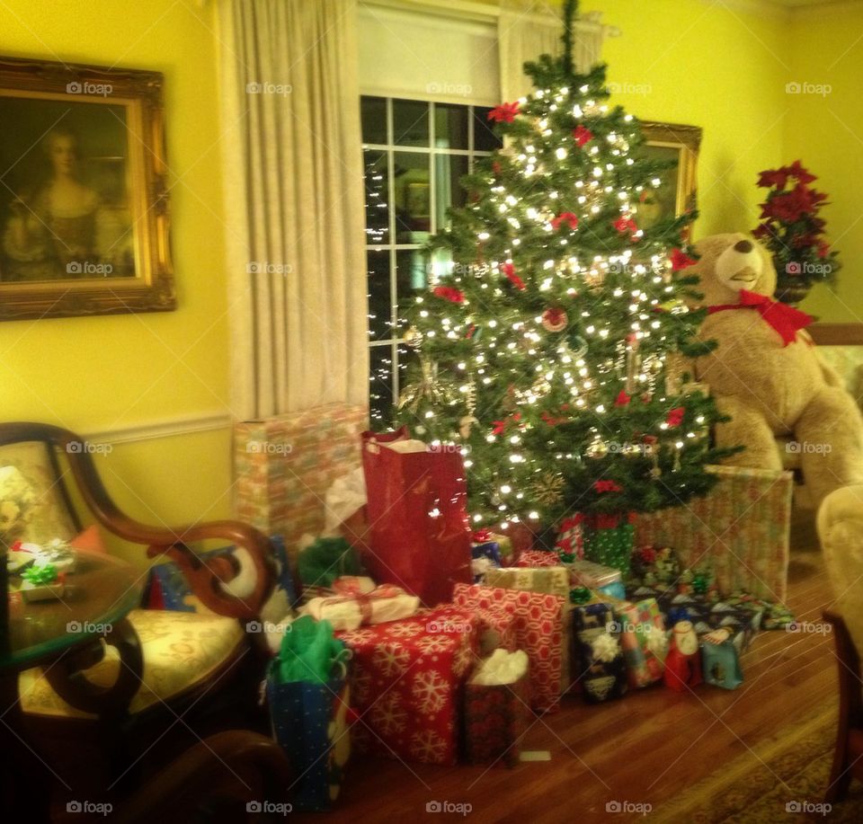Christmas tree with teddy bear and presents. 